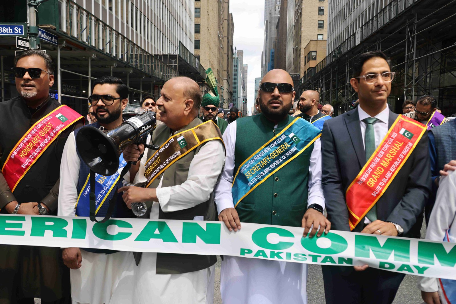 Parade participants showcasing traditional Pakistani music and dance