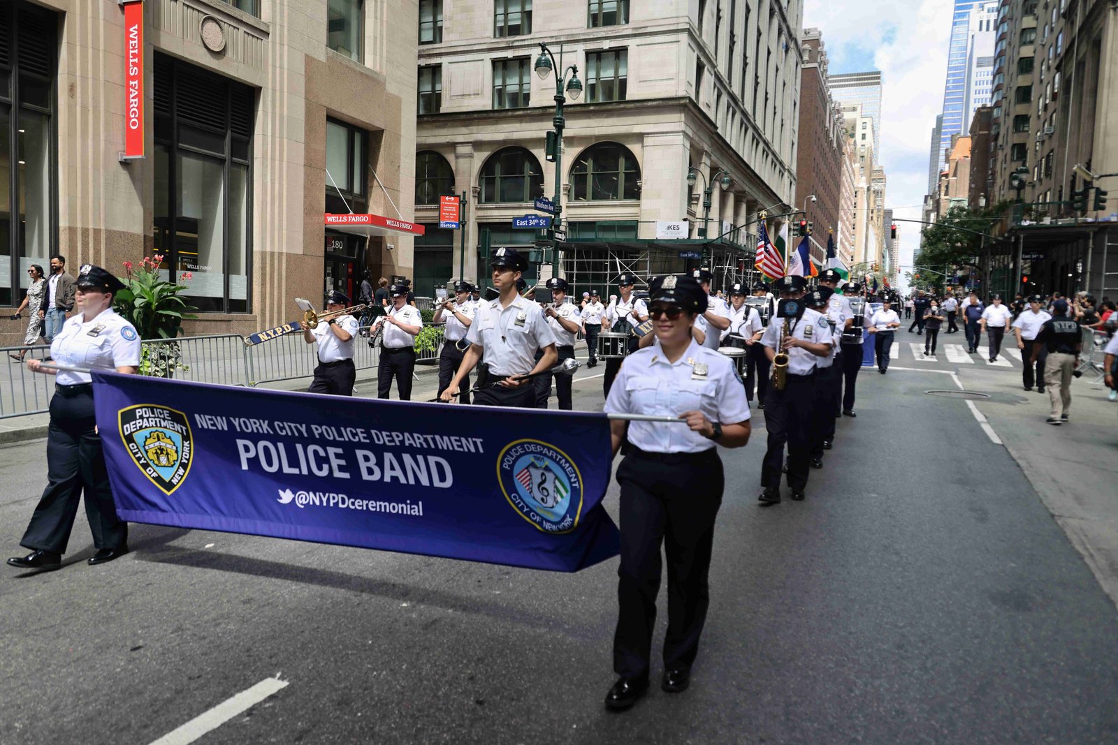 Community gathering at Pakistan Day Parade with flags and decorations